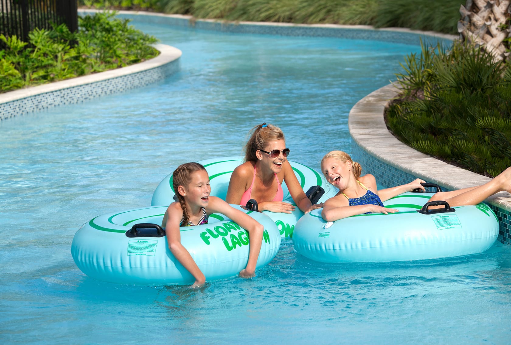 Guests floating on inner tubes in the resort’s Float Lagoon